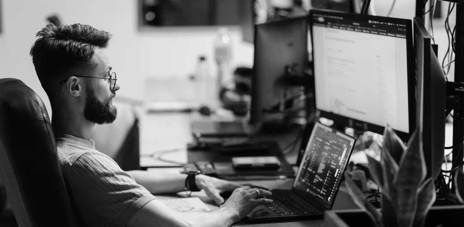 PettersonApps developer working at a multi-monitor setup
