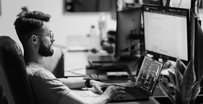 PettersonApps developer working at a multi-monitor setup