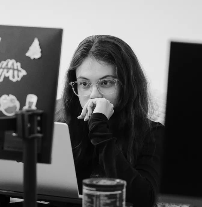 A team member focused at her desk